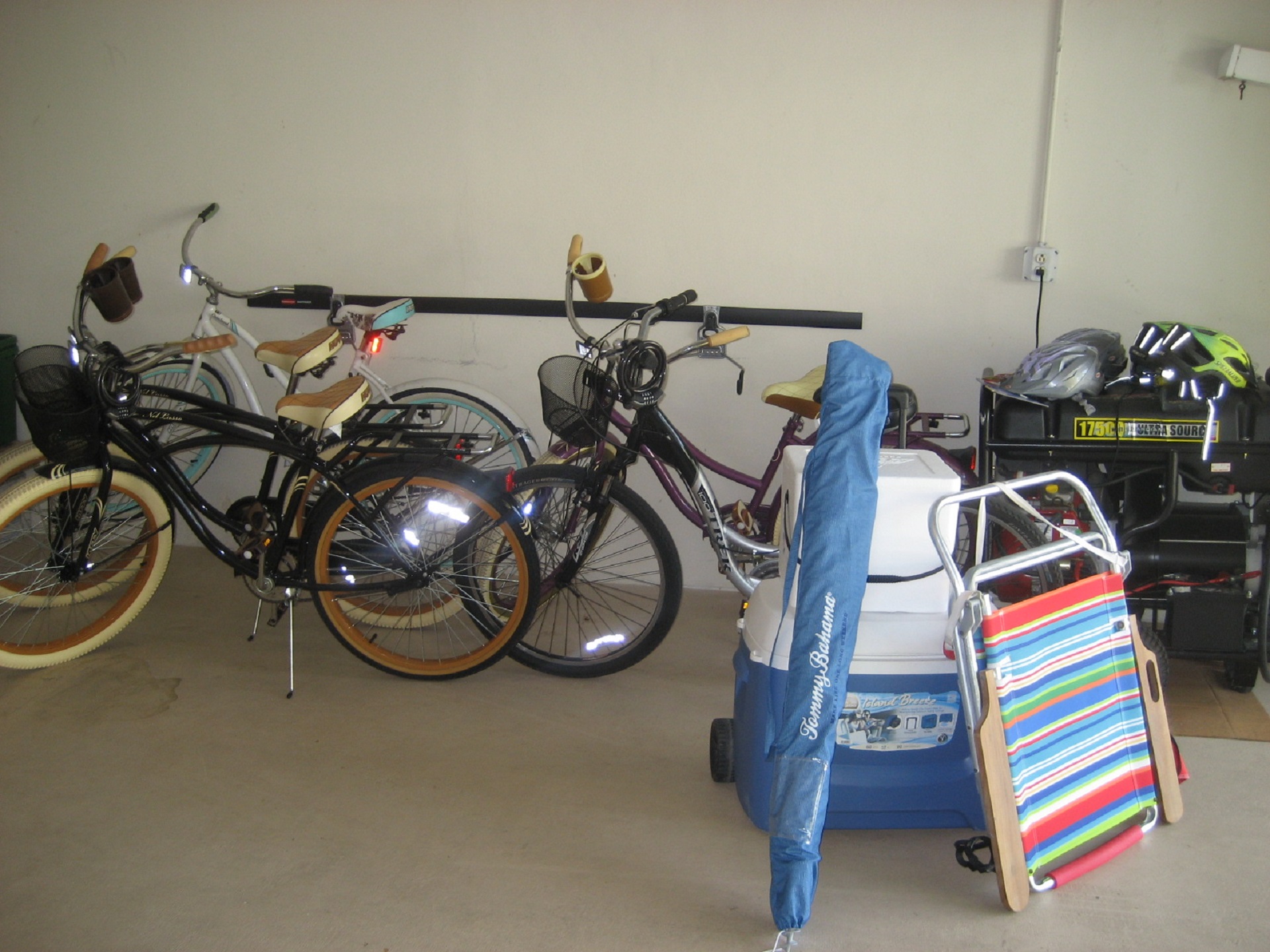 Bicycles, beach umbrellas, beach chairs, coolers and a cart are here at this Naples luxury vacaation beach  rental